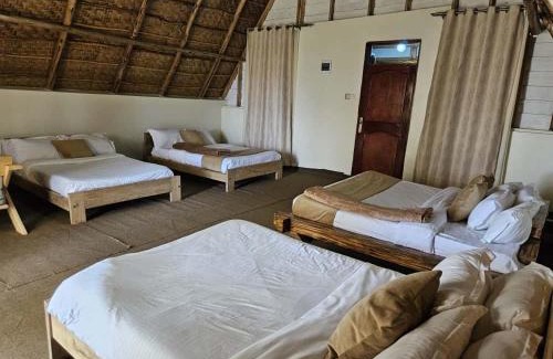 Bugala Island Resort | Bugoma Palms Resort Sand Beach