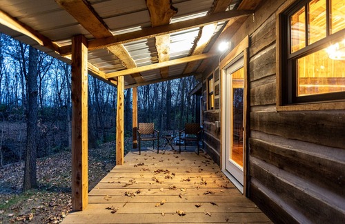 Sunnyland Cabin | Cabin Just Built! features two covered decks, living room, fireplace, kitchen