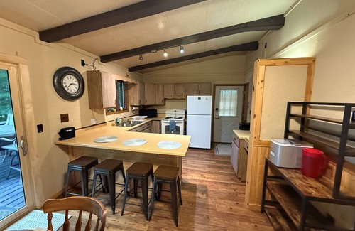 Eagle River House | Cabin on Voyageur Lake–2BR Retreat on ER Chain w/Deck, Firepit & Sandy Beach!