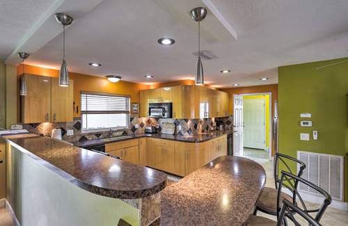 Skylark Estates Cottage | Canal-front Merritt Island Home w/Deck + Grill!