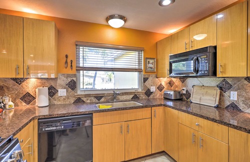 Skylark Estates Cottage | Canal-front Merritt Island Home w/Deck + Grill!
