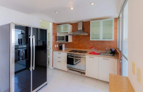 El Yaqui Condo | Capitalia - GYM - Garden - Parking