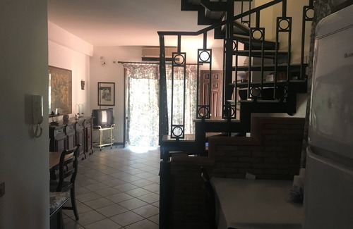 Acireale Apartment | Capomulini villa with private garden, descent to the sea and seasonal swimming pool.