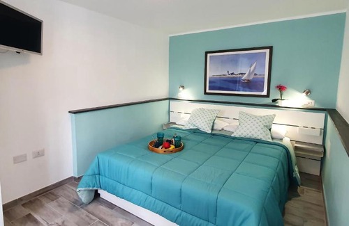 Cala Gonone Apartment | Casa al mare Orchidea - Motoparking - Wifi Free - AC