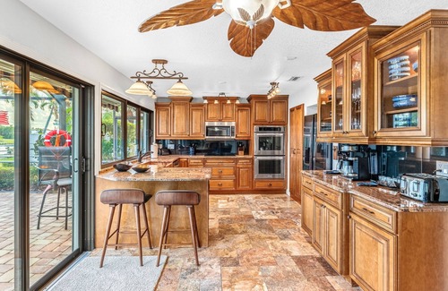 Cocoa Isles House | Casa De Olas Waterfront Luxe Home Heated Pool Boat Lift Minutes to Beach