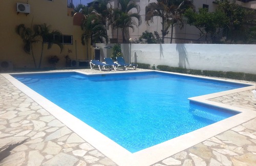 El Batey Apartment | Central guest-friendly condo with pool, cable TV, internet, near everything!