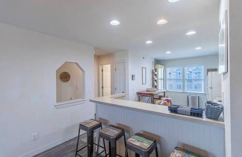 Bermuda Bay House | Centrally located townhome w/a resort-style community pool & gorgeous sunsets!