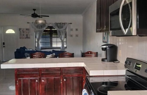 Farmer's Hill House | Centrally located family oriented near grocery store, airport, and beach
