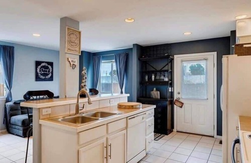 University Hills House | Charming Family Home with Cozy Retreat with comfy beds near all Denver fun.