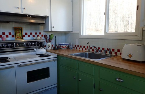 Elkins House | Charming home across from pristine Pleasant Lake, New London