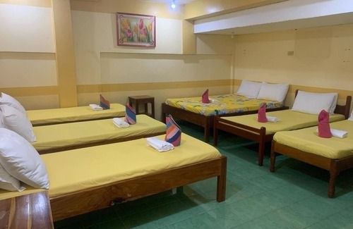 Coron Hotel | "Charming Sunrise Pension House: Budget-Friendly Comfort Steps from Coron Pier"