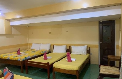 Coron Hotel | "Charming Sunrise Pension House: Budget-Friendly Comfort Steps from Coron Pier"