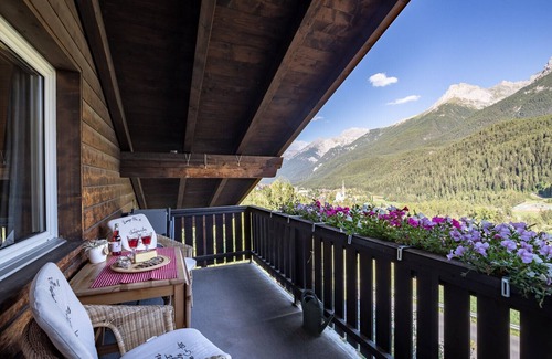 Engadin Scoul Apartment | Chasa Buorcha: Renovated, exceptional 1.5-room penthouse with large panoramic balcony