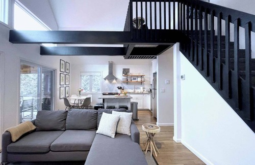 Ferndale House | Chic lakefront retreat with year-round charm. Enjoy Lake Barnabee views, a fully stocked kitchen, and cozy vibes in a nostalgic lake community. Kayak in summer, skate in winter, and take advantage of fun in-home concierge services.