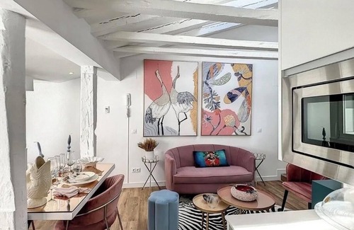 Justicia Apartment | Chic Penthouse with Urban Charm & Rooftop