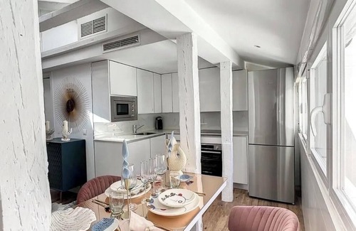 Justicia Apartment | Chic Penthouse with Urban Charm & Rooftop