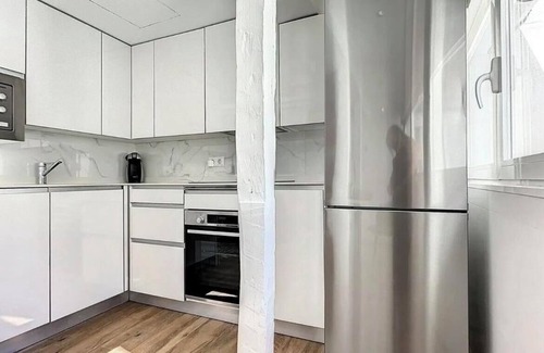 Justicia Apartment | Chic Penthouse with Urban Charm & Rooftop