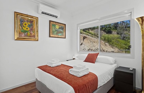 Korora House | Ciao Korora The Mediterranean, overlooking the ocean with magnificent water and mountain views.