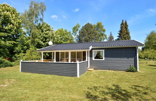 Næsby Strand House | Classic, Danish cottage near the water.