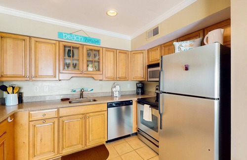 Caine Woods Condo | Coastal and Beachy Condo with Pool and Hot tub access - steps from beach