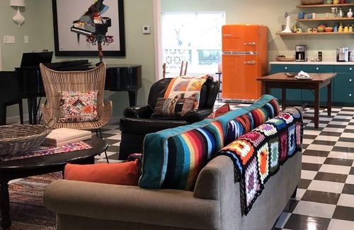 Ingram House | Colorful waterfront retro compound, airstream kitchen, hot tub, media barn!