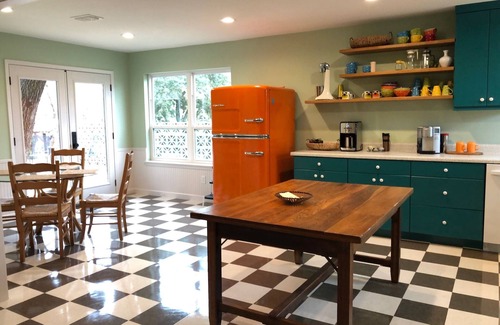 Ingram House | Colorful waterfront retro compound, airstream kitchen, hot tub, media barn!