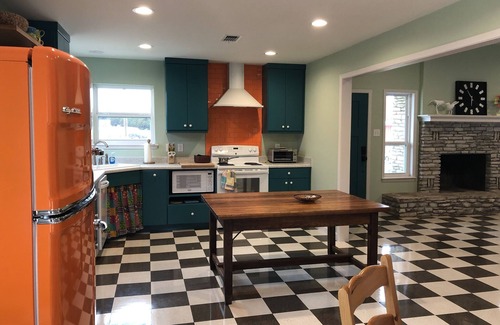 Ingram House | Colorful waterfront retro compound, airstream kitchen, hot tub, media barn!