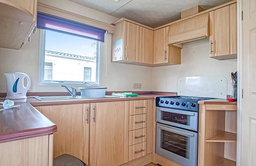 Llanllwchaiarn House | Comfortable caravan with one double and two twin.