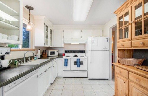 University Place House | Comfortable home with Puget Sound view, decks, garden patio, WiFi & W/D