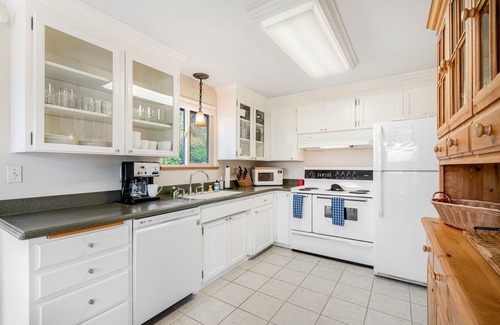 University Place House | Comfortable home with Puget Sound view, decks, garden patio, WiFi & W/D
