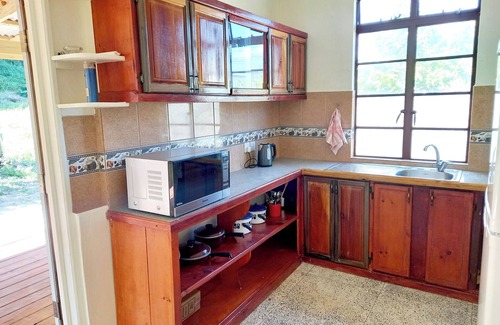 Calibishie House | Comfortable, local home with A/C and private verandah