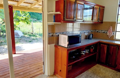 Calibishie House | Comfortable, local home with A/C and private verandah