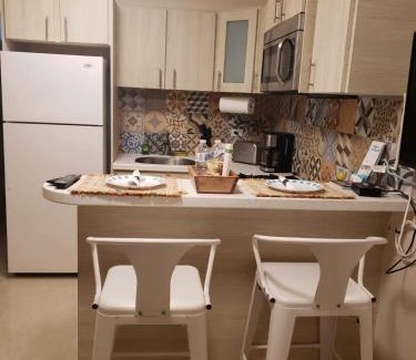 Bucana Apartment | Compact Haven with Private Entrance and FREE Parking and Laundry
