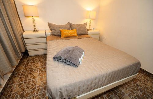 Bucana Apartment | Compact Haven with Private Entrance and FREE Parking and Laundry