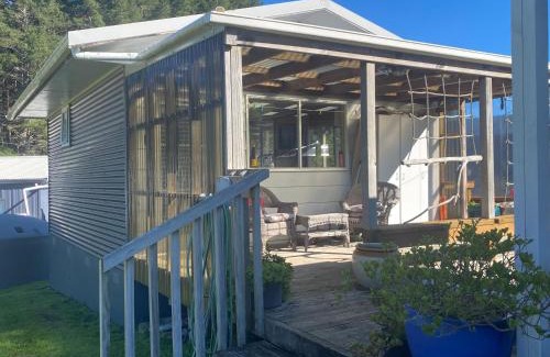 Kawhia House | Cosy Aotea Harbour Cottage - water views