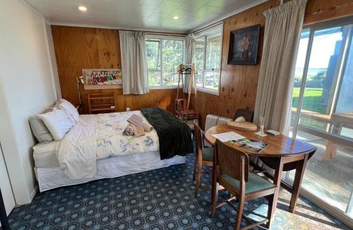 Kawhia House | Cosy Aotea Harbour Cottage - water views