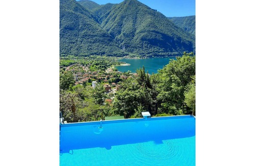 Porlezza House | Cosy apartment in villa for 4 guests with pool, WIFI, TV, patio, pets allowed and parking