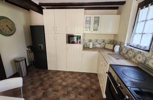 Guerquesalles Cottage | Cottage with shared swimming pool, hot tub, fishing, tennis, UK TV and Wi-Fi