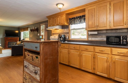 Deerfield House | Country home with cozy fireplace