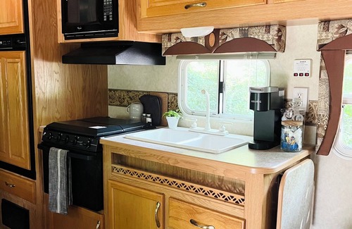 Mohnton House | Cozy 2-bedroom RV- Picnic Area, Fire Ring, and can walk to Maple Grove Raceway