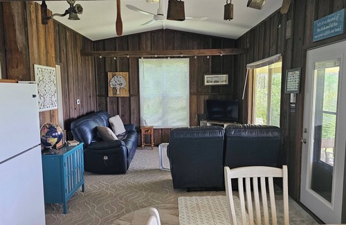 Allegan Cottage | Cozy 2-bedroom Waterfront Cottage with 80' dock on 2.5 Acres. Privacy Galore!