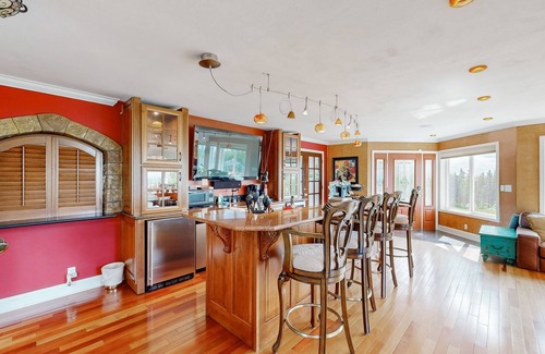 Mid-Hillside Apartment | Cozy apartment with large deck with views, hot tub & wood stove