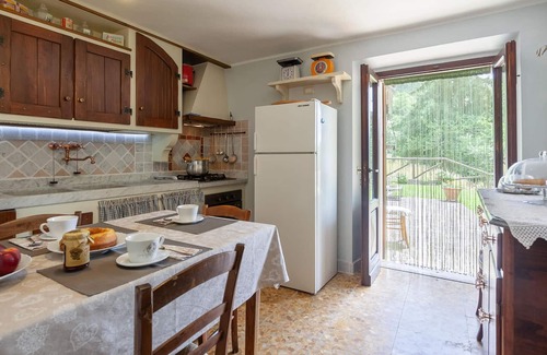 Piazza al Serchio House | Cozy cottage with fireplace and stunning views.