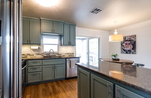 Galindo House | Cozy house, covered outdoor kitchen & living w/TV. Convenient location!