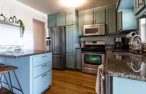 Galindo House | Cozy house, covered outdoor kitchen & living w/TV. Convenient location!