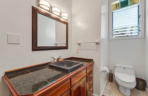 Honokaa House | Cozy Ohana suite with private patio, deck, & tropical garden setting