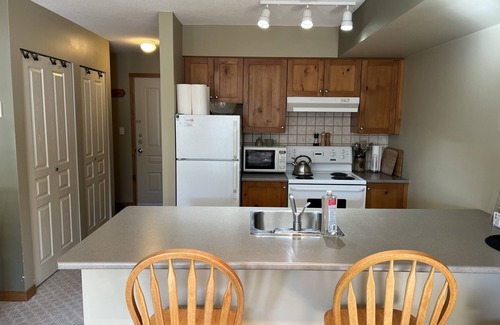 Silver Star Mountain Condo | Cozy slope side Creekside condo with views - steps from the ski way!