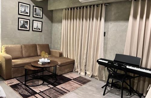 Kaunlaran Apartment | Cozy Spacious Hotel Type Condo with PS5 Smart TV and WiFi
