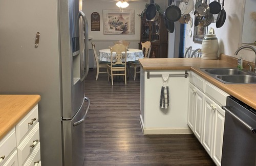 Monticello House | Cozy Victorian home with inviting front porch and fenced back yard pet friendly.