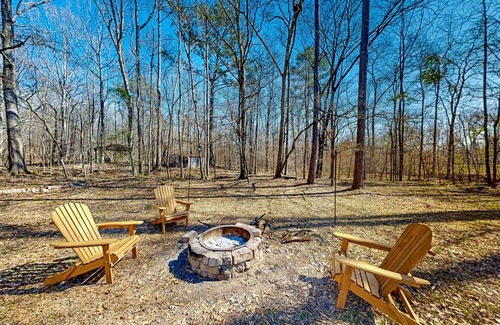 Forsyth House | Creekside home with firepit, yard games, deck, wood stove, & W/D